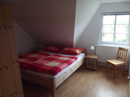 Schlafzimmer mit Doppelbett / Ferienwohnung "Haus Iwersen" in Hattstetdtermarsch