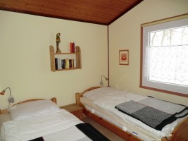 Schlafzimmer mit zwei Einzelbetten / Ferienhaus "Haus Nixe" in Simonsberg