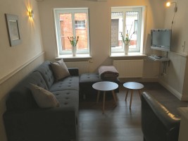 Gemütliches, stilvolles Wohnzimmer mit Kabel-TV und DVD / Ferienhaus "Hannes Kapitänshaus" in Husum