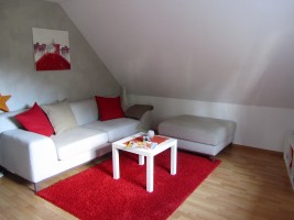 das Wohnzimmer / Ferienwohnung "Ferienwohnung Holt" in Husum