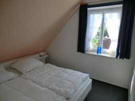 Schlafzimmer / Ferienhaus "Muschelsucher 1" in Nordstrand-Norderhafen